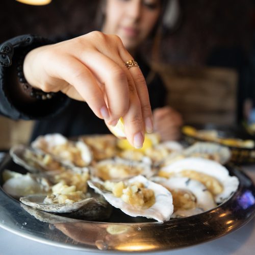 Guest eating oyster