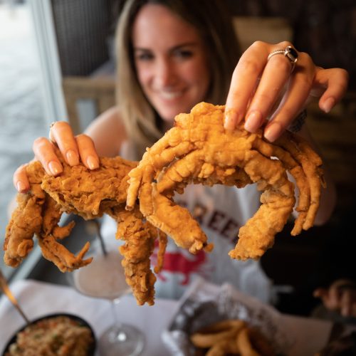 Guest showing fried crabs